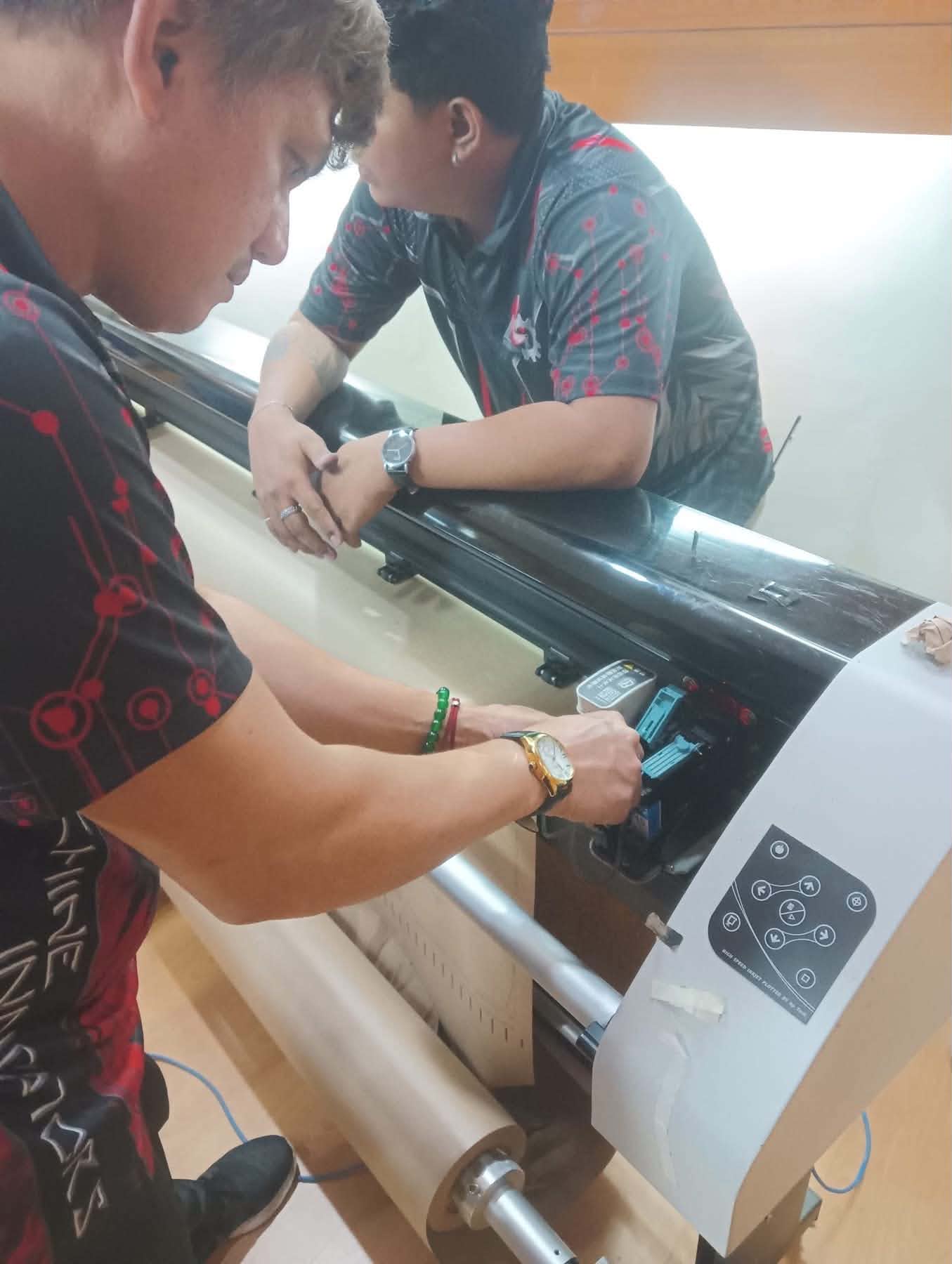 Technician working on printer 2