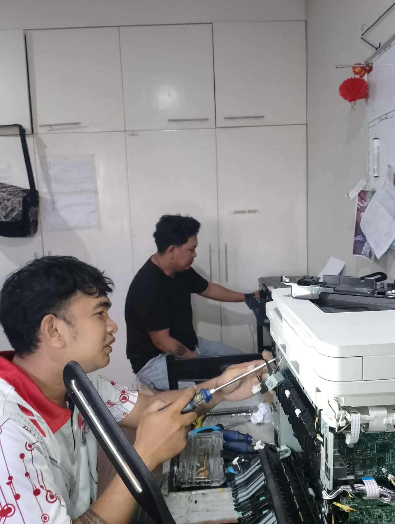 Technician working on printer 3