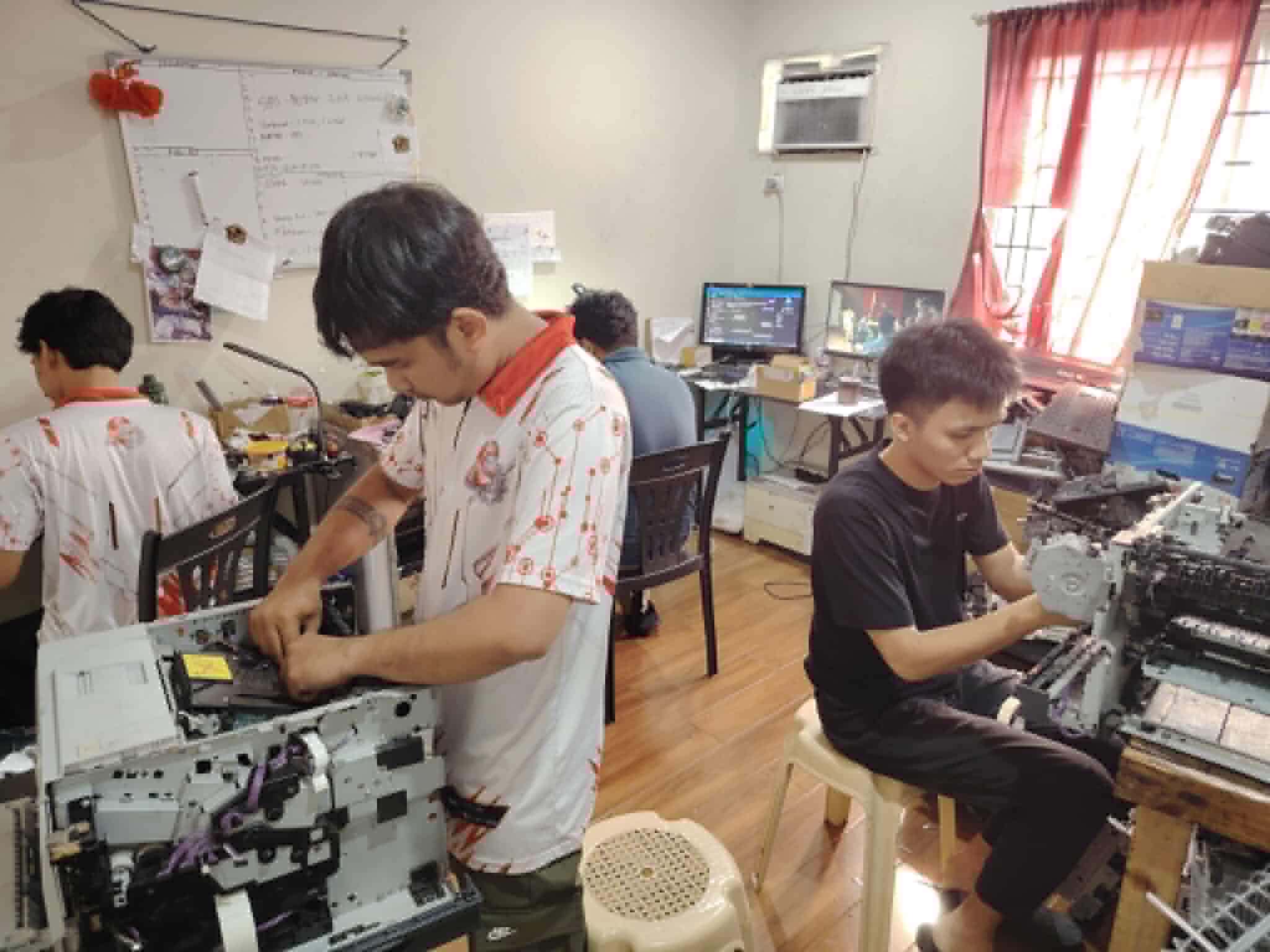 Technician working on printer 5
